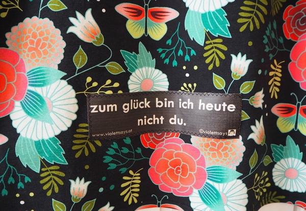 a-linie mit taschen zitat